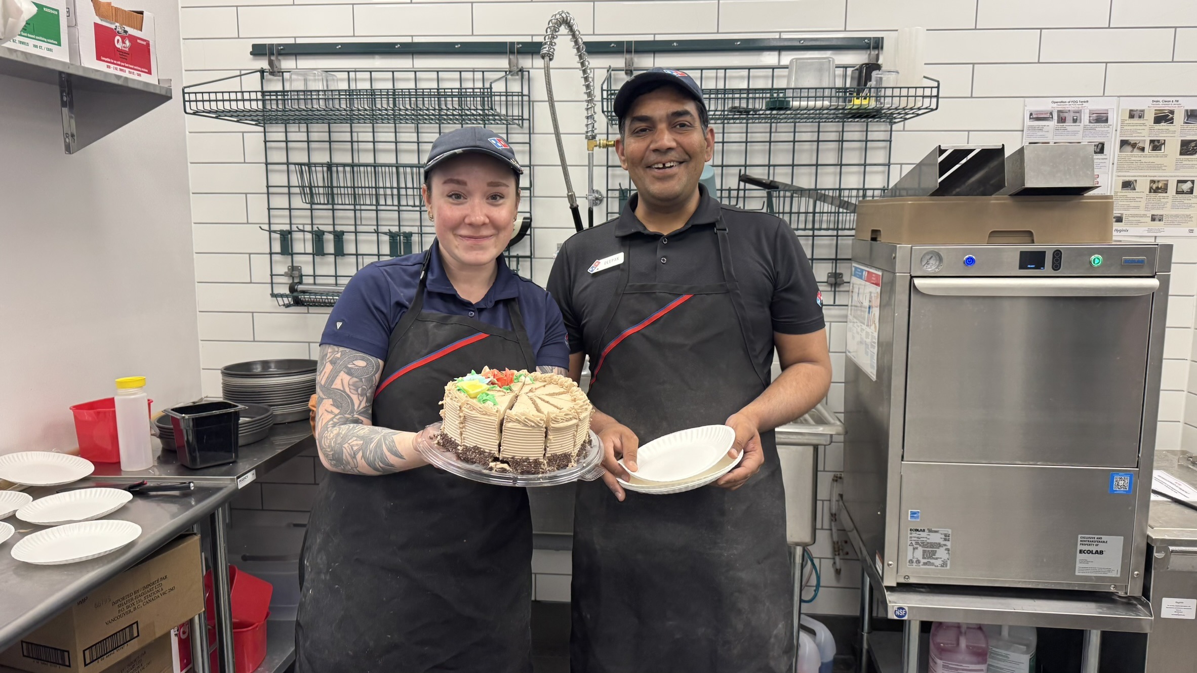 Sierra Blackwell and Deepak in a Domino’s store
